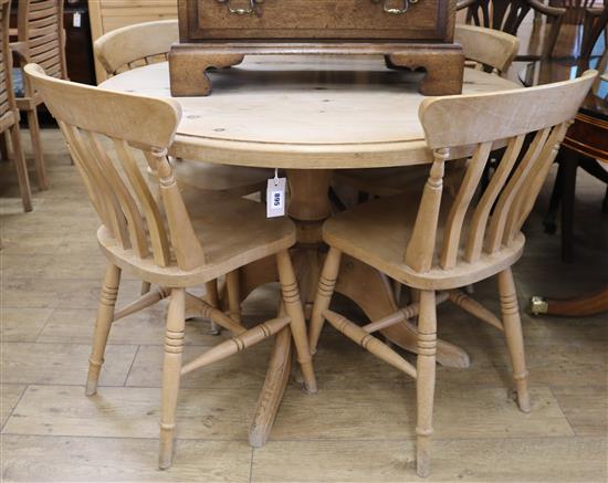 A pine table and four chairs W.105cm